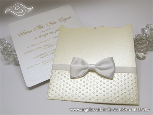 cream wedding invitation with white bow